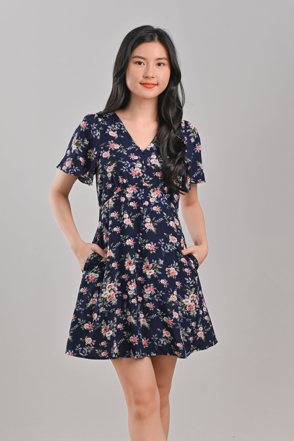 ELLISE FLORAL BUTTON DRESS-ROMPER IN NAVY ELLISE FLORAL BUTTON DRESS-ROMPER IN NAVY