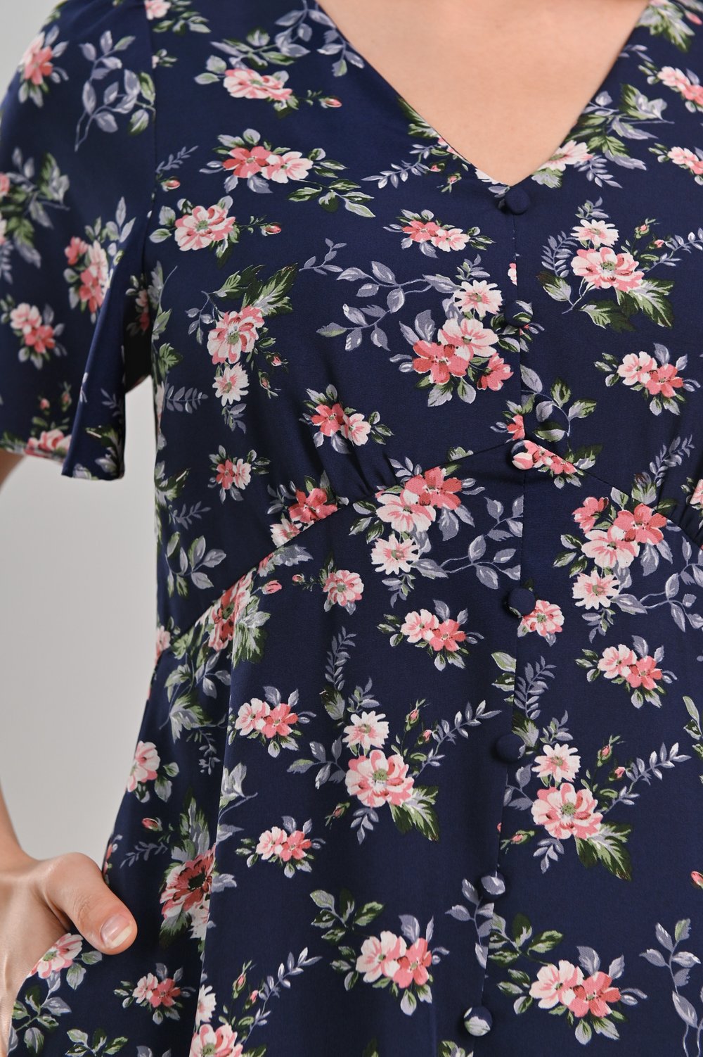 ELLISE FLORAL BUTTON DRESS-ROMPER IN NAVY ELLISE FLORAL BUTTON DRESS-ROMPER IN NAVY