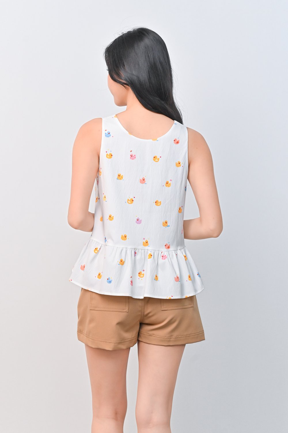 RUBBER DUCKIE WHITE PEPLUM TOP RUBBER DUCKIE WHITE PEPLUM TOP