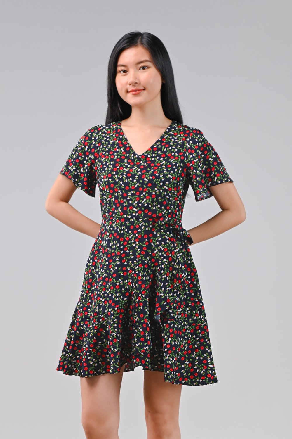 DALLIE FLORAL RUFFLE DRESS-ROMPER IN NAVY DALLIE FLORAL RUFFLE DRESS-ROMPER IN NAVY