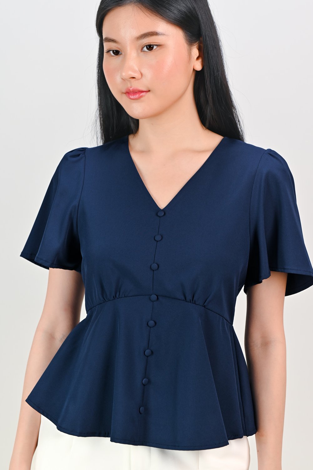 ERICA SLEEVED PEPLUM TOP IN NAVY