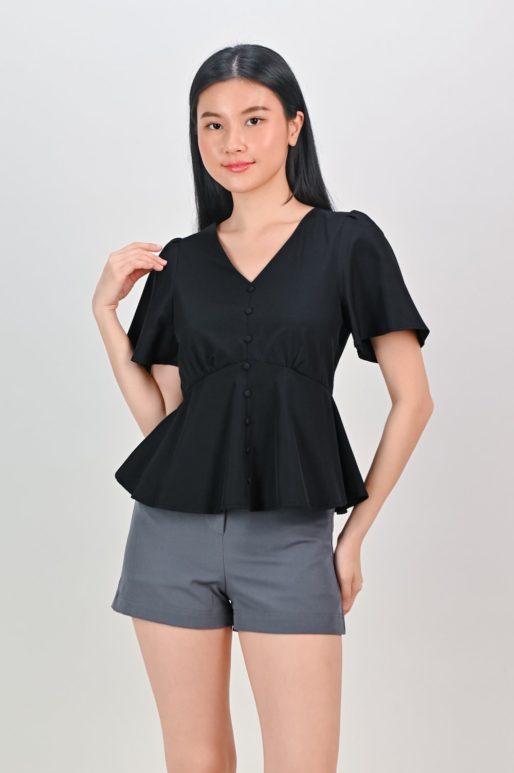ERICA SLEEVED PEPLUM TOP IN BLACK
