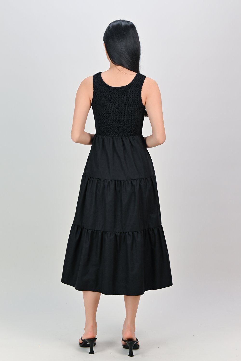 WAVERLY SLEEVELESS SMOCKED DRESS IN BLACK