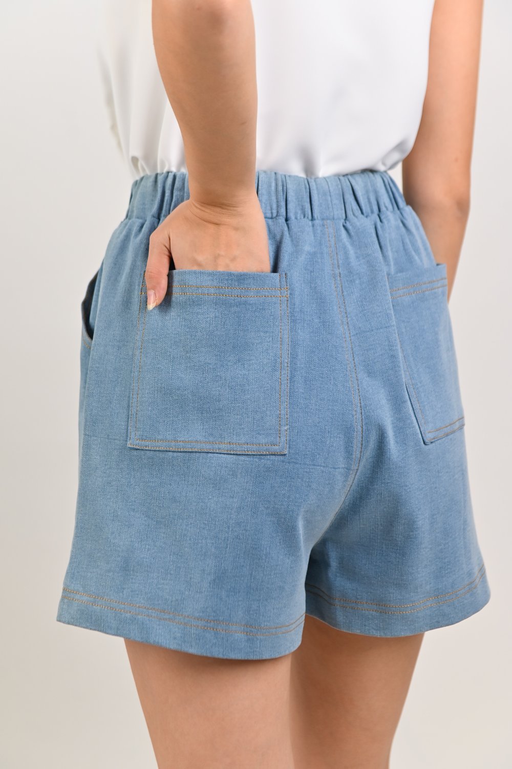 ZORANA ELASTIC-WAIST SHORTS IN LIGHT DENIM ZORANA ELASTIC-WAIST SHORTS IN LIGHT DENIM