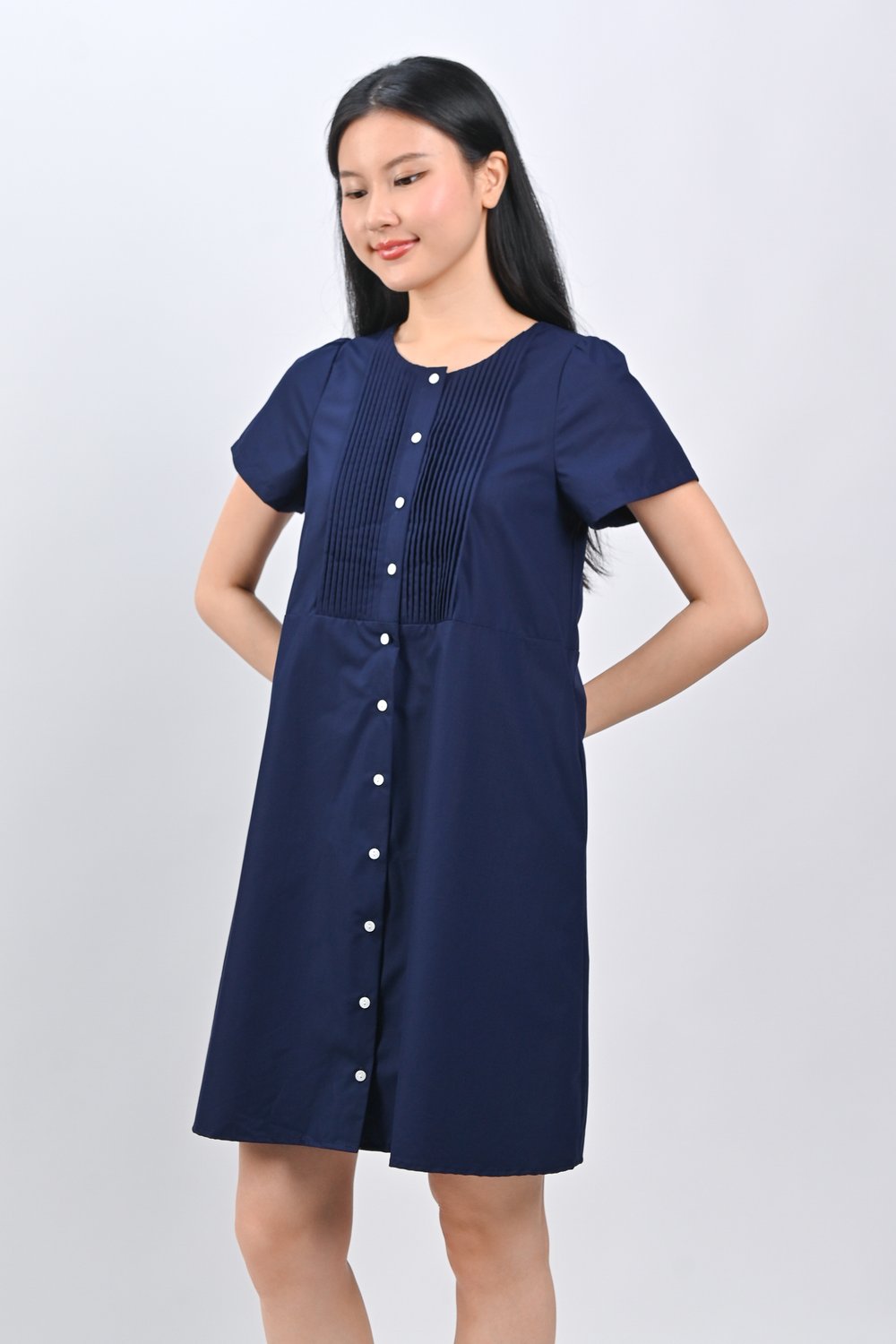 OPHYRA PINTUCK BABYDOLL DRESS IN NAVY