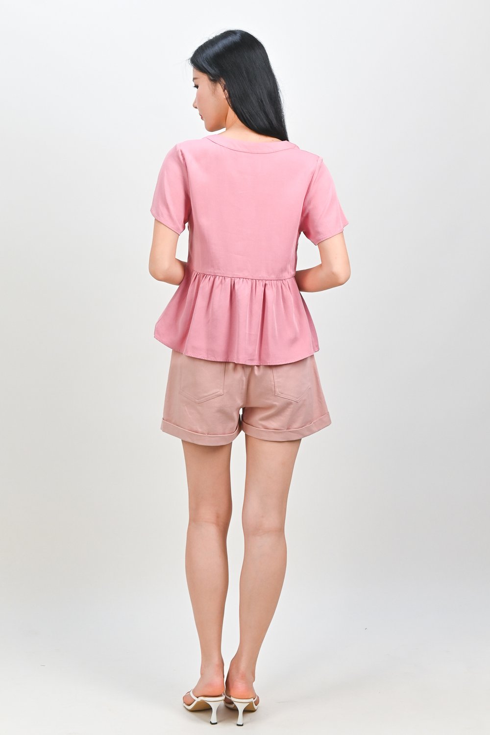 NEMIRA NOTCHED-NECK PEPLUM TOP IN PINK