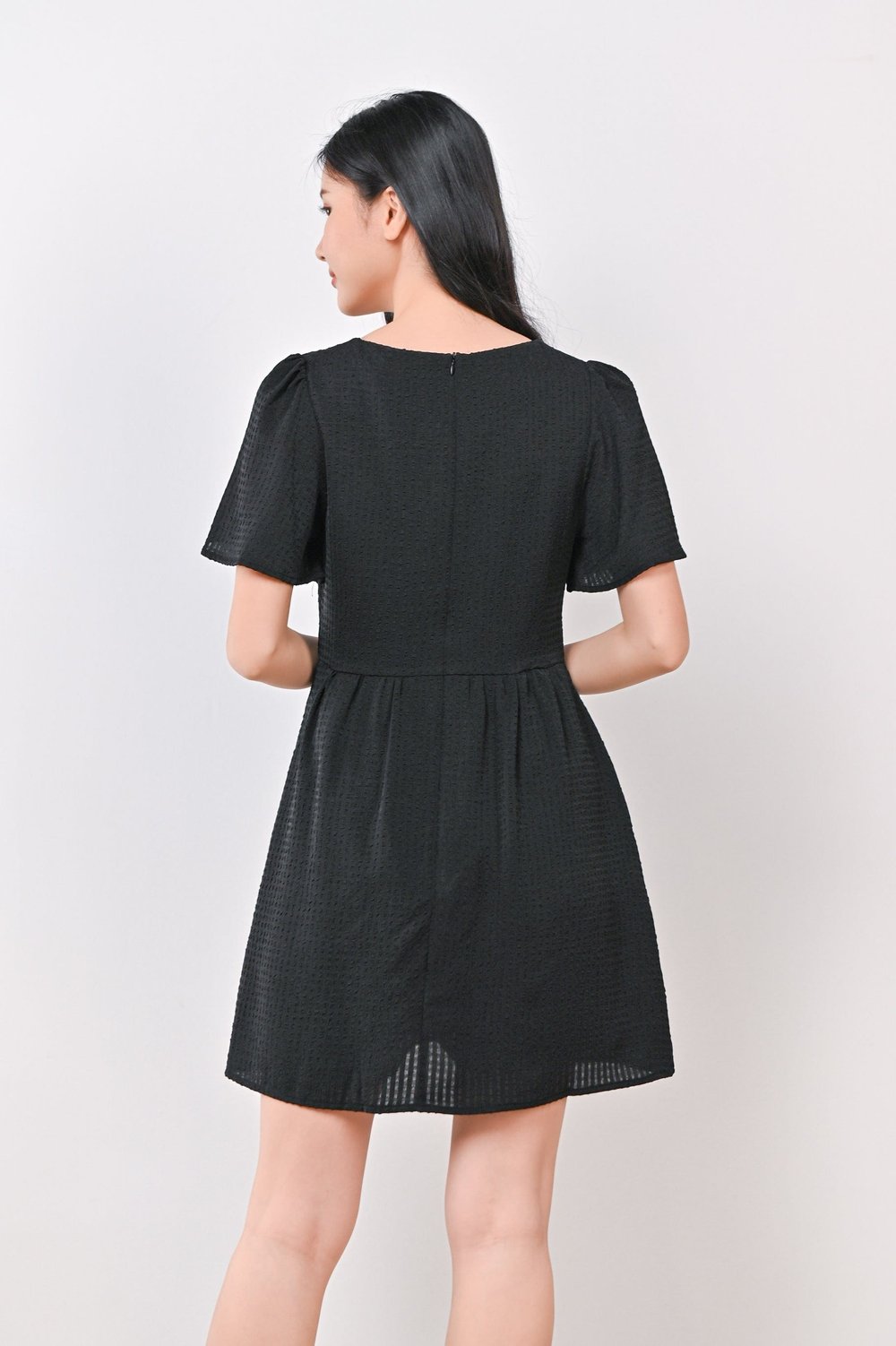 AMBER TEXTURED DRESS-ROMPER IN BLACK